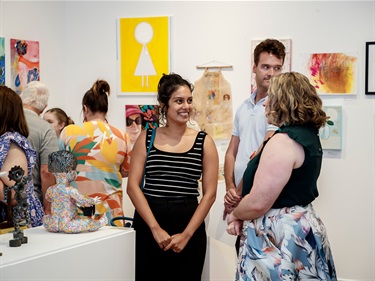 Participants smiling in the Artz Blitz gallery.