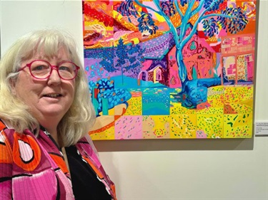 Magnify artist Kerry Liang pictured with artwork in a gallery