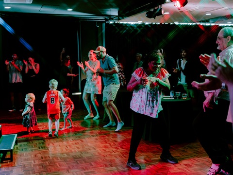People dancing and clapping at City Hall