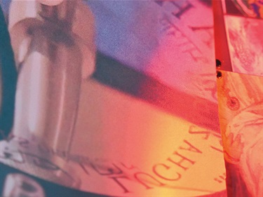 A digitally manipulated image blending close-ups of technology parts, with a red, yellow and pink tinged colour overlay