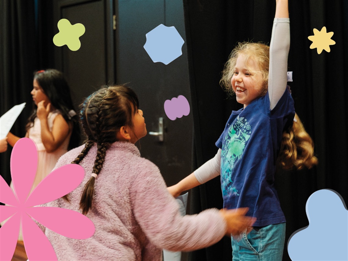 Children dancing and playing, surrounded by floating colourful shapes.