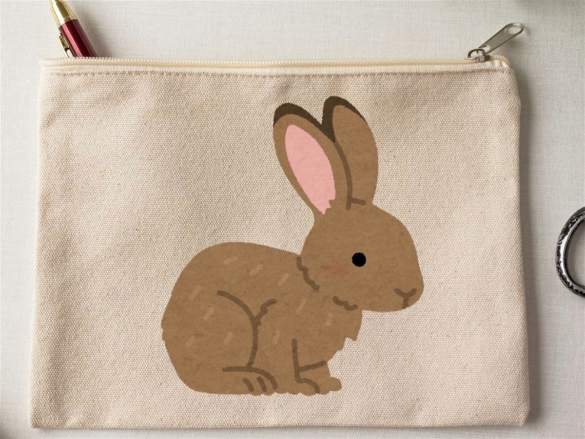 A pencil case with a brown illustrated rabbit on it.
