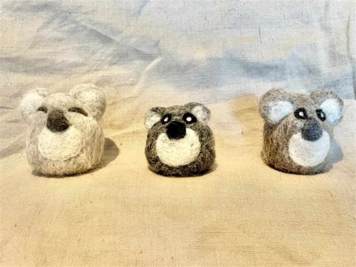 Three grey felted koalas