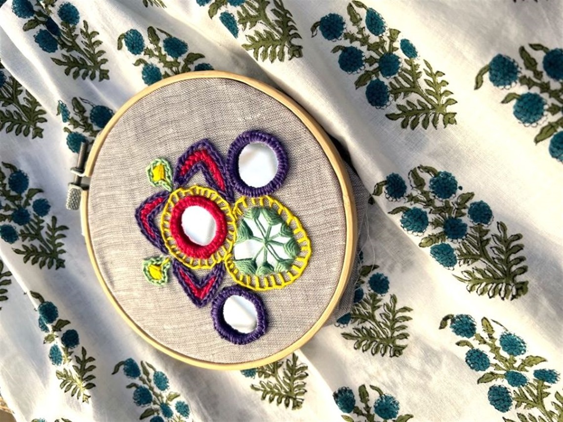 Colourful hand embroidery with small round mirrors