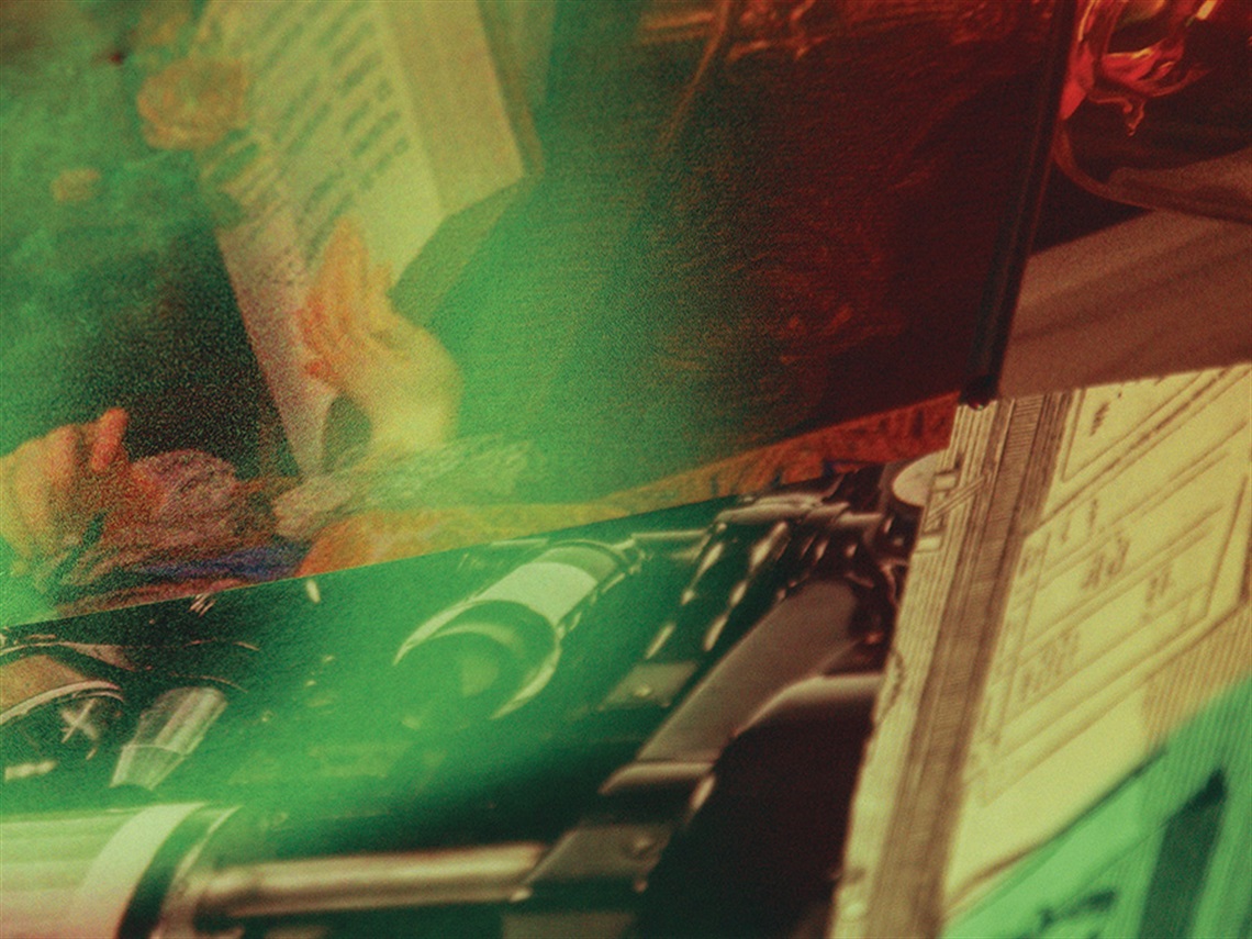 A digitally manipulated image blending skewed imagery of a hand over a book and technology parts side by side, with a red and green tinged colour overlay