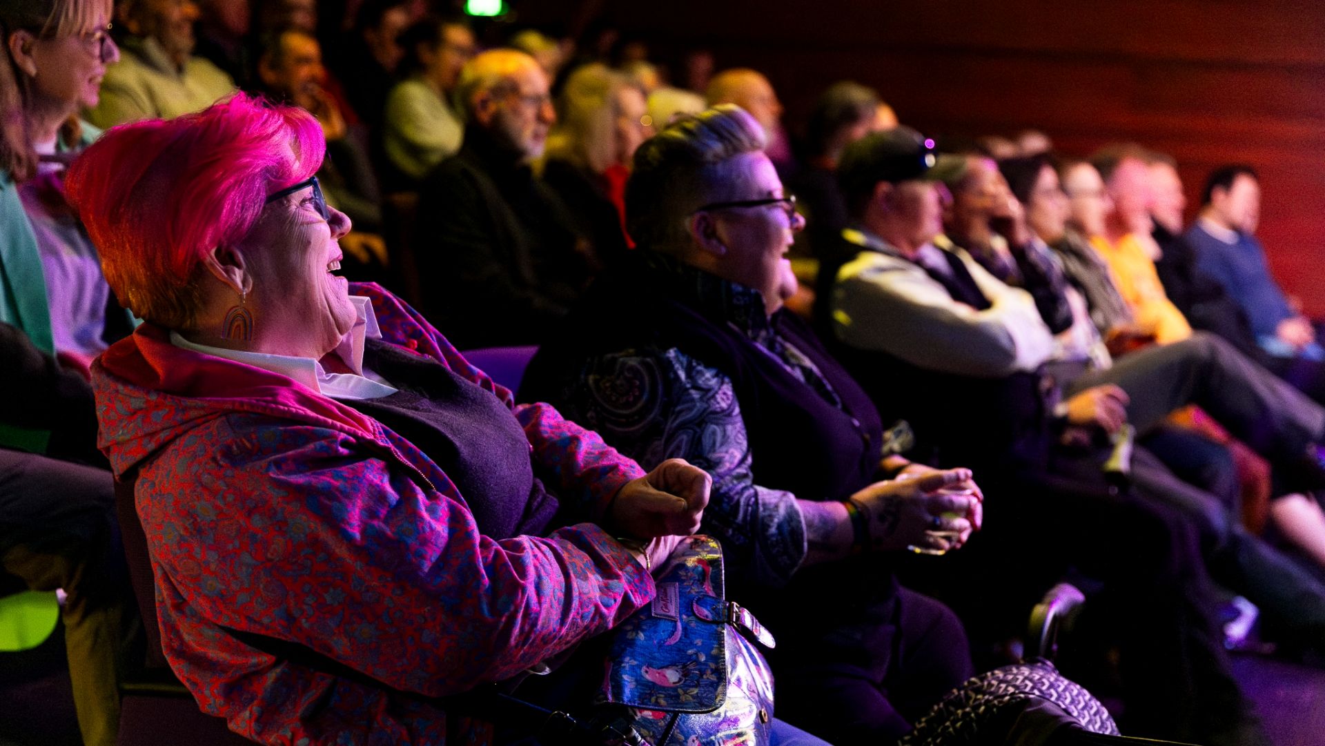 Audience at the Shirley Burke theatre laughing during a show